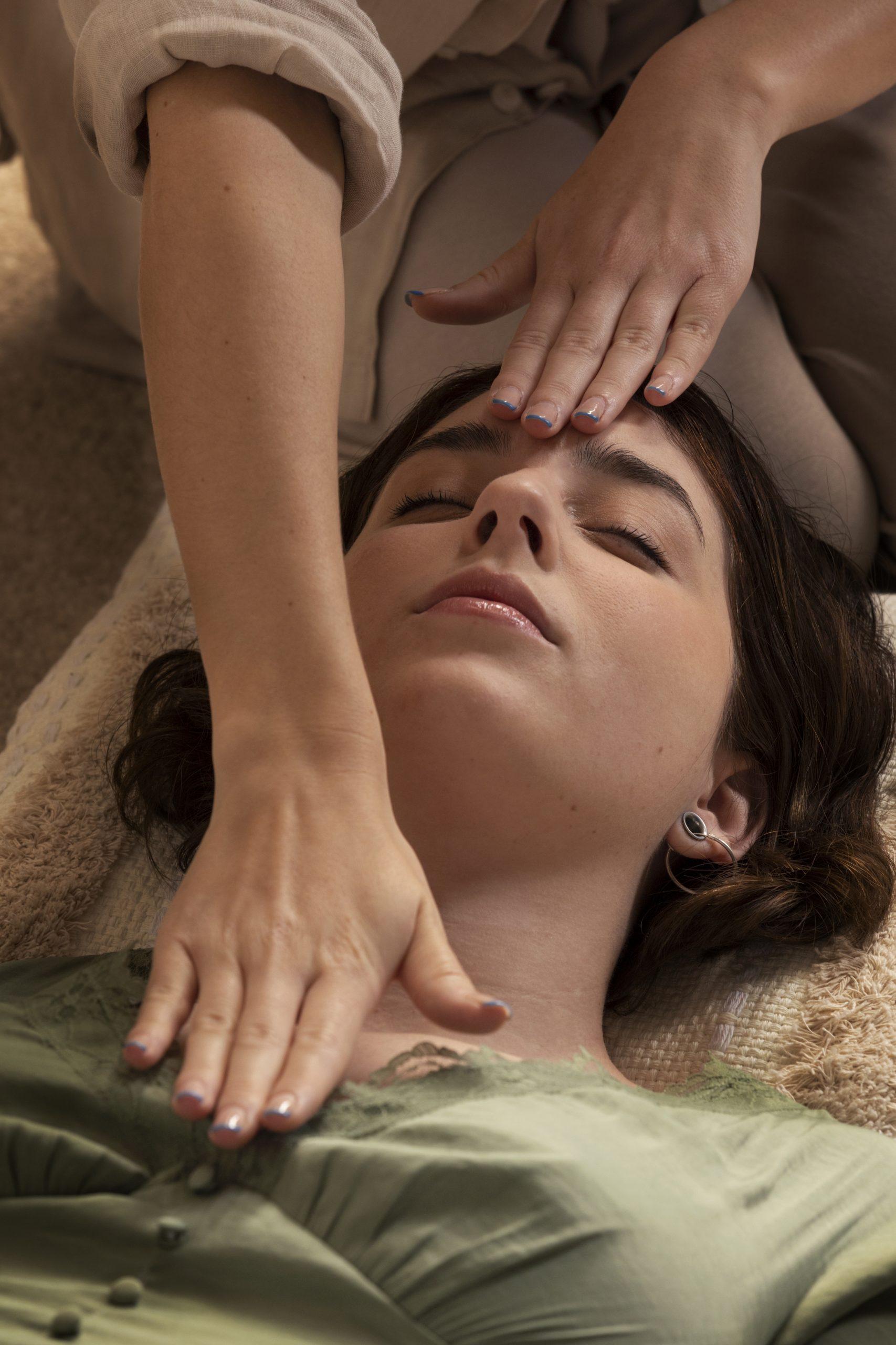 Woman receiving a relaxing facial massage, enhancing wellness and tranquility.